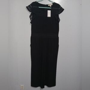 MICHAEL KORS BLACK JUMPSUIT SZ XL (HAS SMALL DEFECT IN THE THREADING ON TRIM)